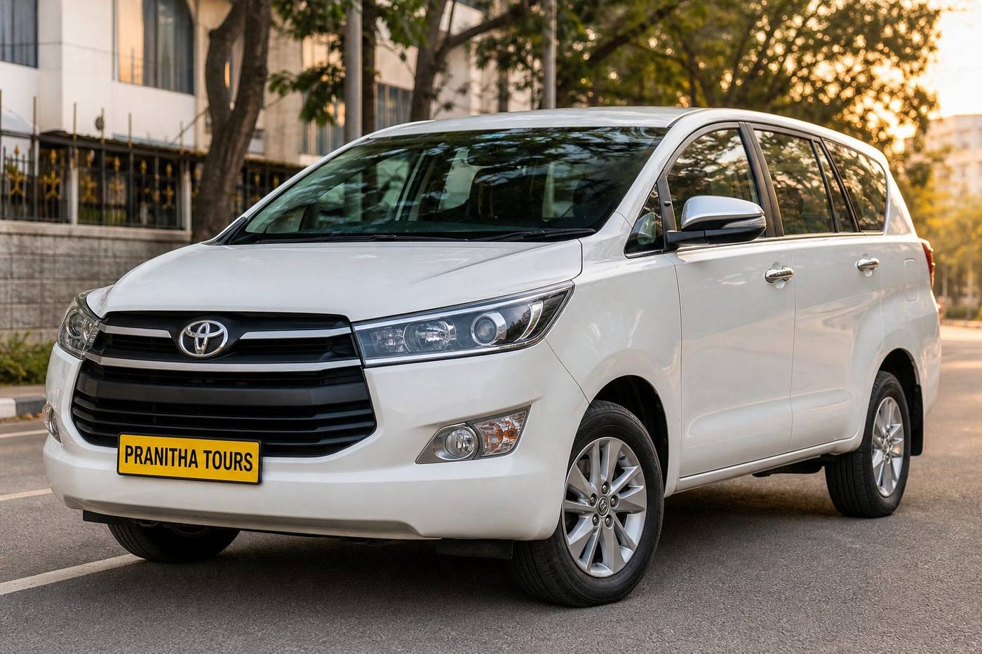 Toyota Innova Crysta with Pranitha Tours yellow plate at Bengaluru airport