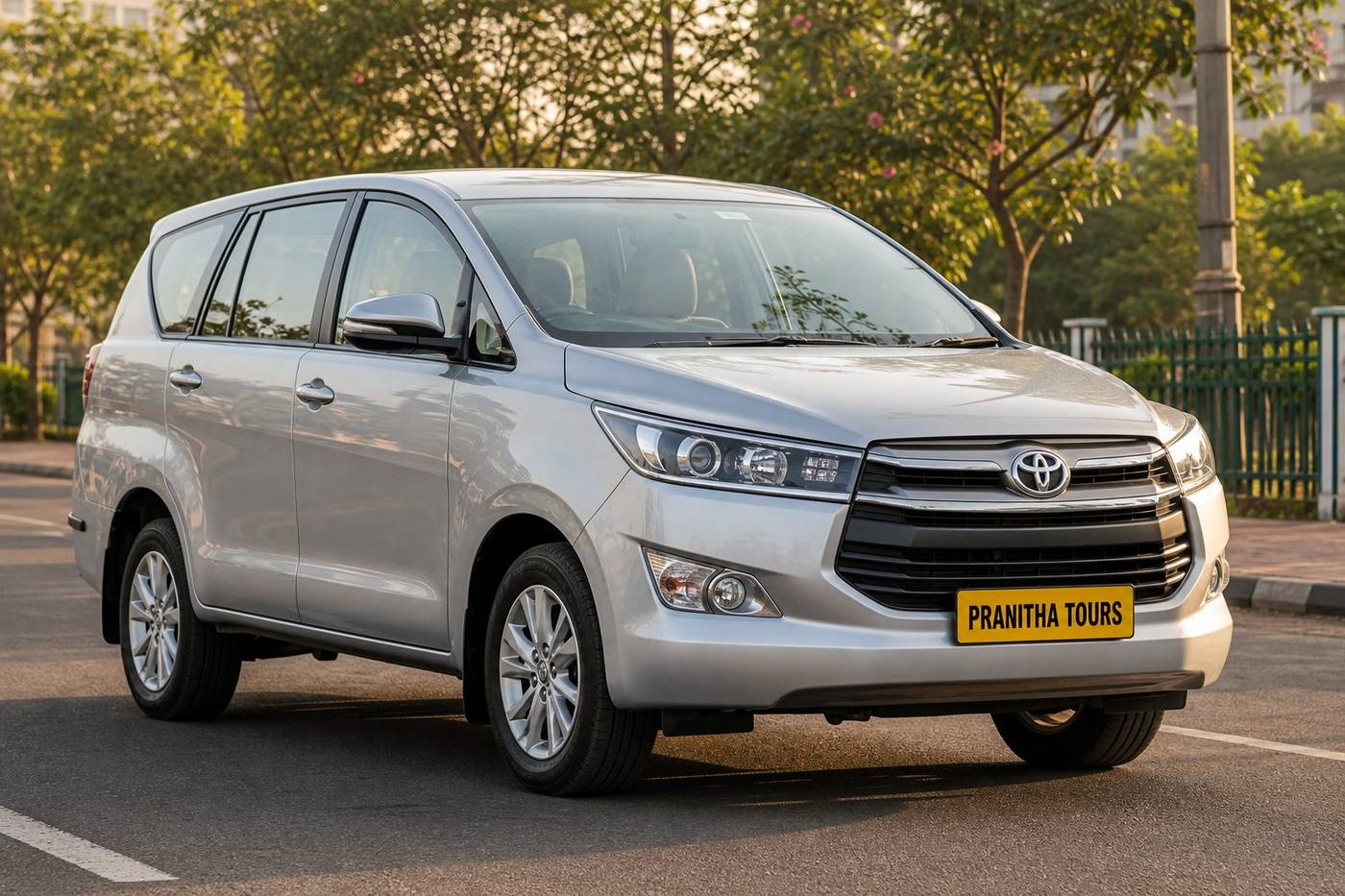 Toyota Innova with Pranitha Tours yellow plate on a Bengaluru street